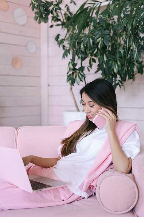 a-woman-in-white-shirt-sitting-on-the-couch