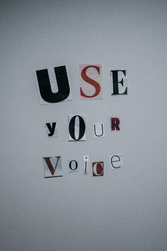 use-your-voice-inscription-on-gray-background
